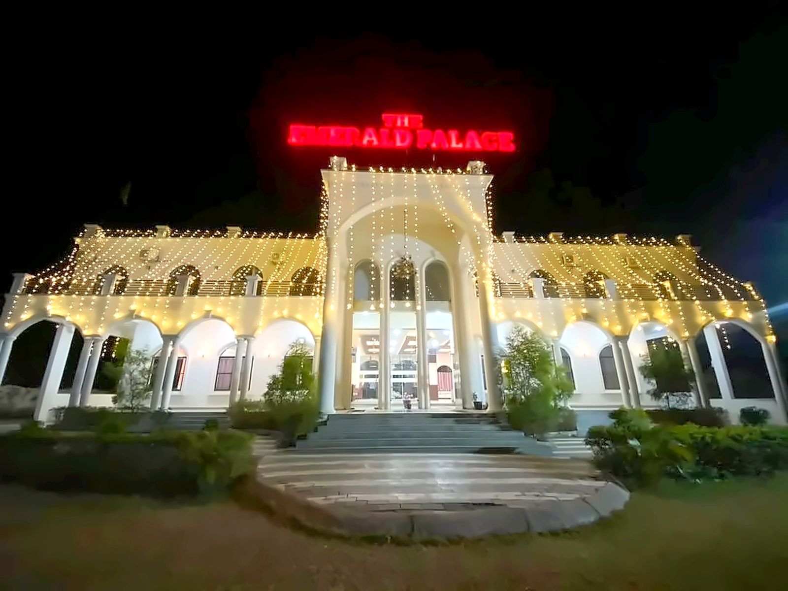 The Emerald Palace lit at night